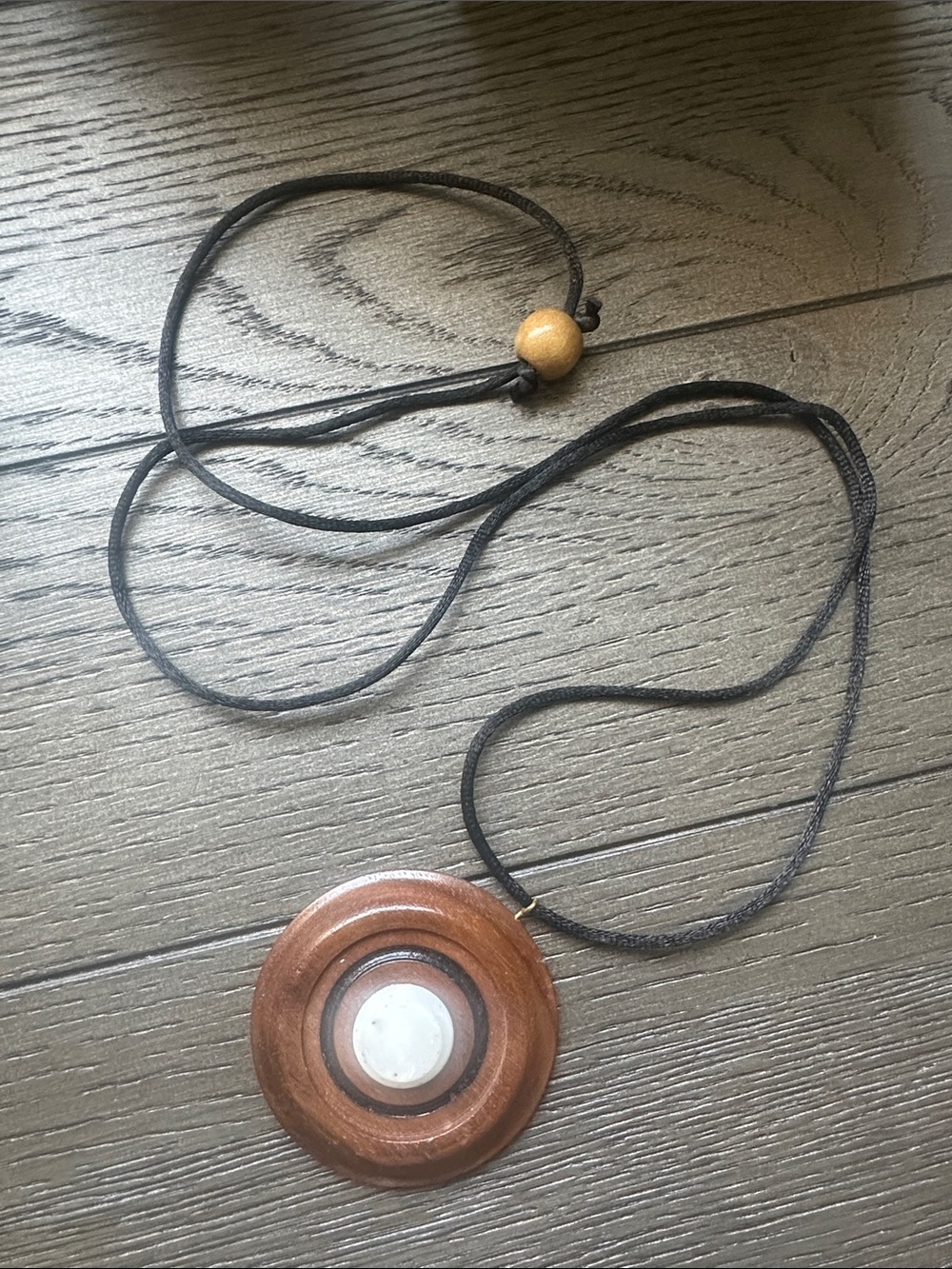 Brown Wood Circle Pendant Necklace with Black Cord
